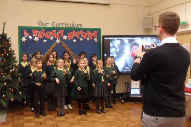 Parkend pupils are filmed by Five Acres High School’s Mr Jonny Brinson singing and signing along with
Shakin’ Stevens for Coleford’s Christmas Lights Switch On event