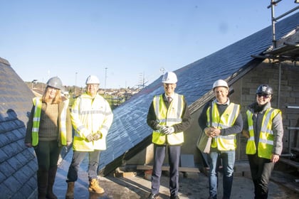 Harper checks out new Levelling Up-funded solar panels at the Wesley