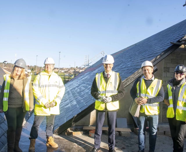 Harper checks out new Levelling Up-funded solar panels at the Wesley