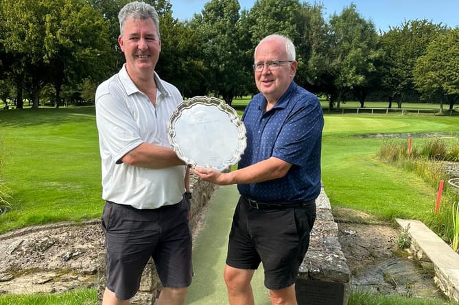 Richard Keeble, (left), receiving the John Barton Salver, from Handicap and Competition Secretary Clive Winward.