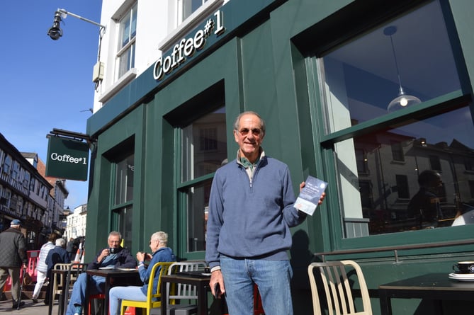 Tom Vaughan with his book "Hope and the Hedgehog" outside of Coffee #1