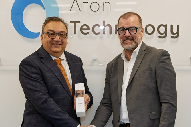Sabih Chaudhry, CEO for Afon Technology, (left) being presented with the Junkosha’s Technology Innovator of the Year Award