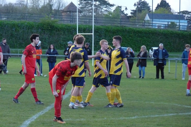 Monmouth Town players celebrate a goal