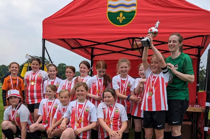 Kerys Harrop and the winning Ross Juniors U10 girls' team