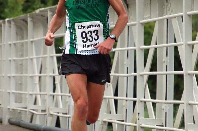 Forest of Dean Athletic Club's Julian Bailey-Gard crosses the Wireworks Bridge.