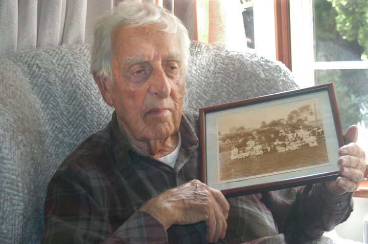 Man holds old photo