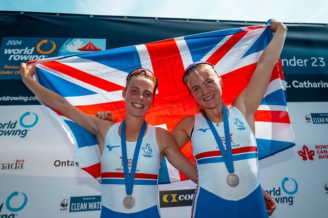 Violet Holbrow-Brooksbank, right, and Olivia Cheesmur celebrate silver at the world U19 championships in Canada