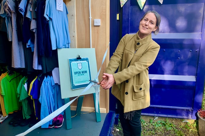 Louise Bayfield cuts the ribbon to open the shop.