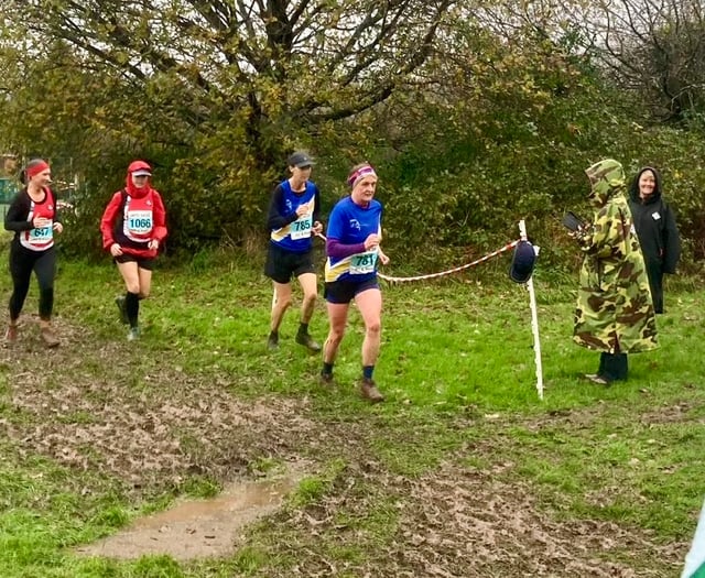 Runners brave the weather to storm home